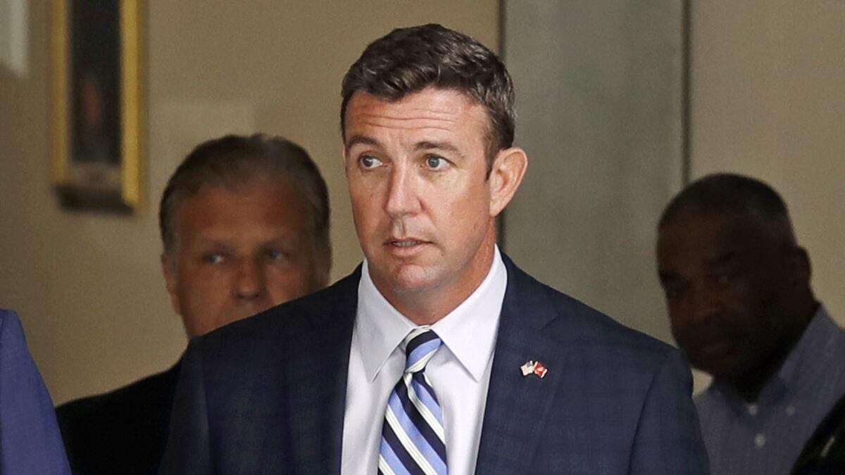 U.S. Rep. Duncan Hunter leaves an arraignment hearing on Aug. 23 in San Diego after he and his wife, Margaret, pleaded not guilty to charges they illegally used his campaign account for personal expenses.