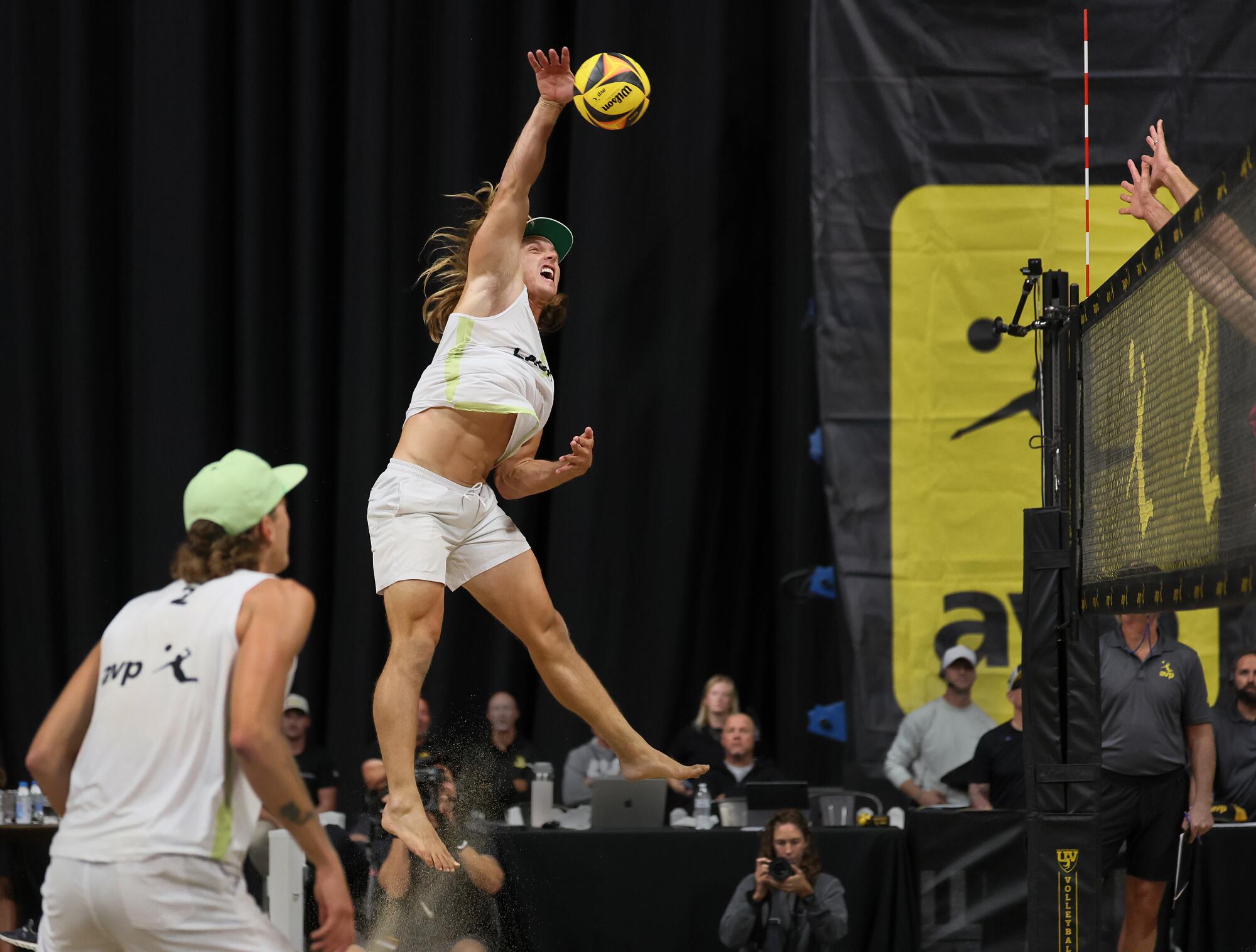 L.A. Launch's Hagen Smith spikes the ball as Logan Webber watches as their team defeated Palm Beach Passion.