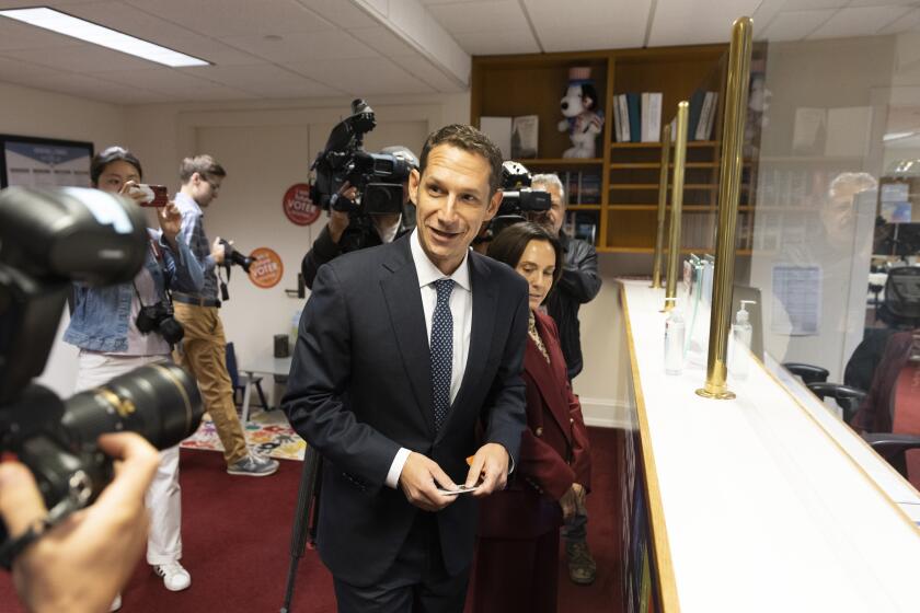Daniel Lurie, philanthropist and Levi Strauss heir, arrives with wife Becca Prowda at the Department of Elections to file paperwork to participate in the upcoming mayoral election, in San Francisco, Tuesday, Sept. 26, 2023. (Stephen Lam/San Francisco Chronicle via AP)