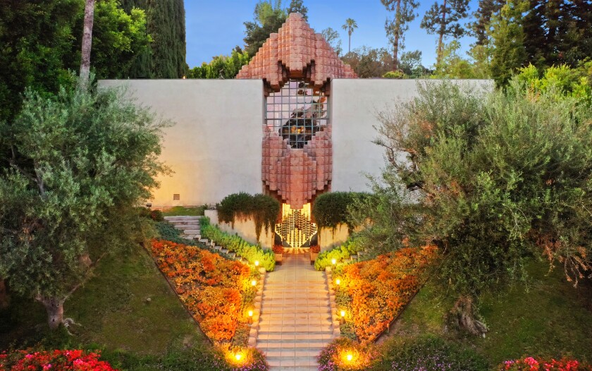 Built in 1927, a neo-Mayan-style showplace is made of concrete textile blocks.