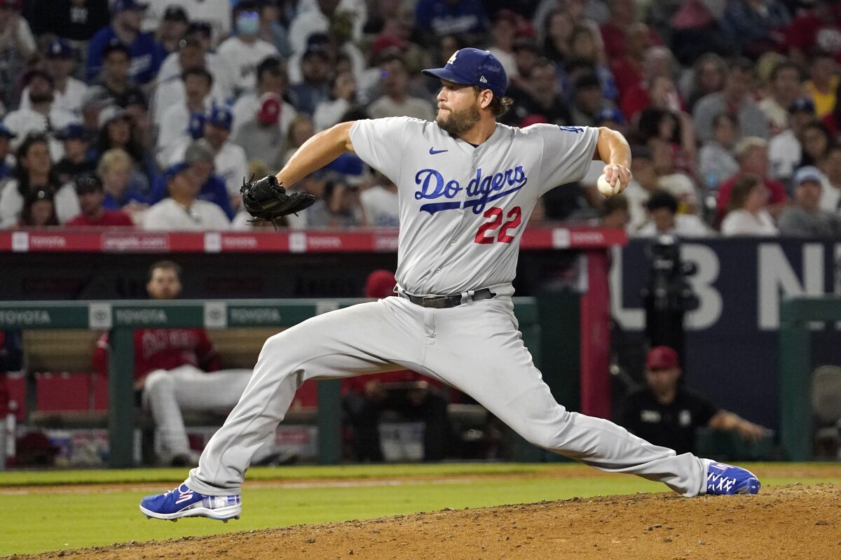 Los Angeles Dodgers starting pitcher Clayton Kershaw throws to the plate during the seventh inning of a baseball game against the Los Angeles Angels Friday, July 15, 2022, in Anaheim, Calif. (AP Photo/Mark J. Terrill)