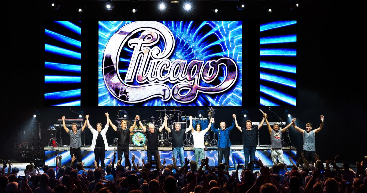The rock band Chicago take a bow at the end of a concert.