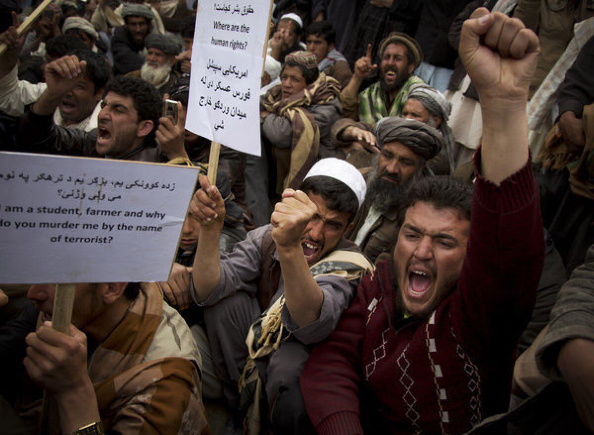 Afghan men chant "U.S. special operations forces out!" as several hundred demonstrators marched to the parliament building in Kabul, Afghanistan earlier this month. The senior commander of U.S. forces in the country said Saturday that American special operations forces have handed over their base in eastern Afghanistan's Nerkh district to Afghan troops.