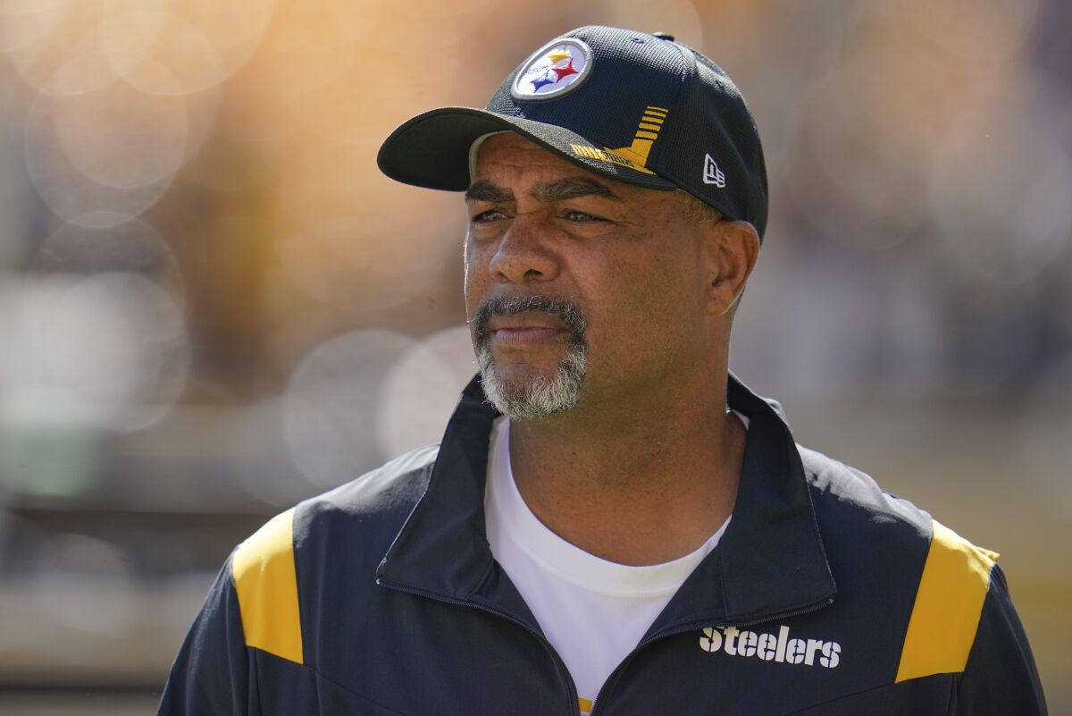 FILE - Pittsburgh Steelers senior defensive assistant coach Teryl Austin watches the team warm up before an NFL football game against the Cincinnati Bengals, Sunday, Sept. 26, 2021, in Pittsburgh. Teryl Austin has been where Brian Flores currently is many times. Eleven to be exact. That's the number of head coaching interviews the Pittsburgh Steelers senior defensive assistant has had through the years, some of which made Austin feel as if he was only there to check a box. (AP Photo/Gene J. Puskar, File)