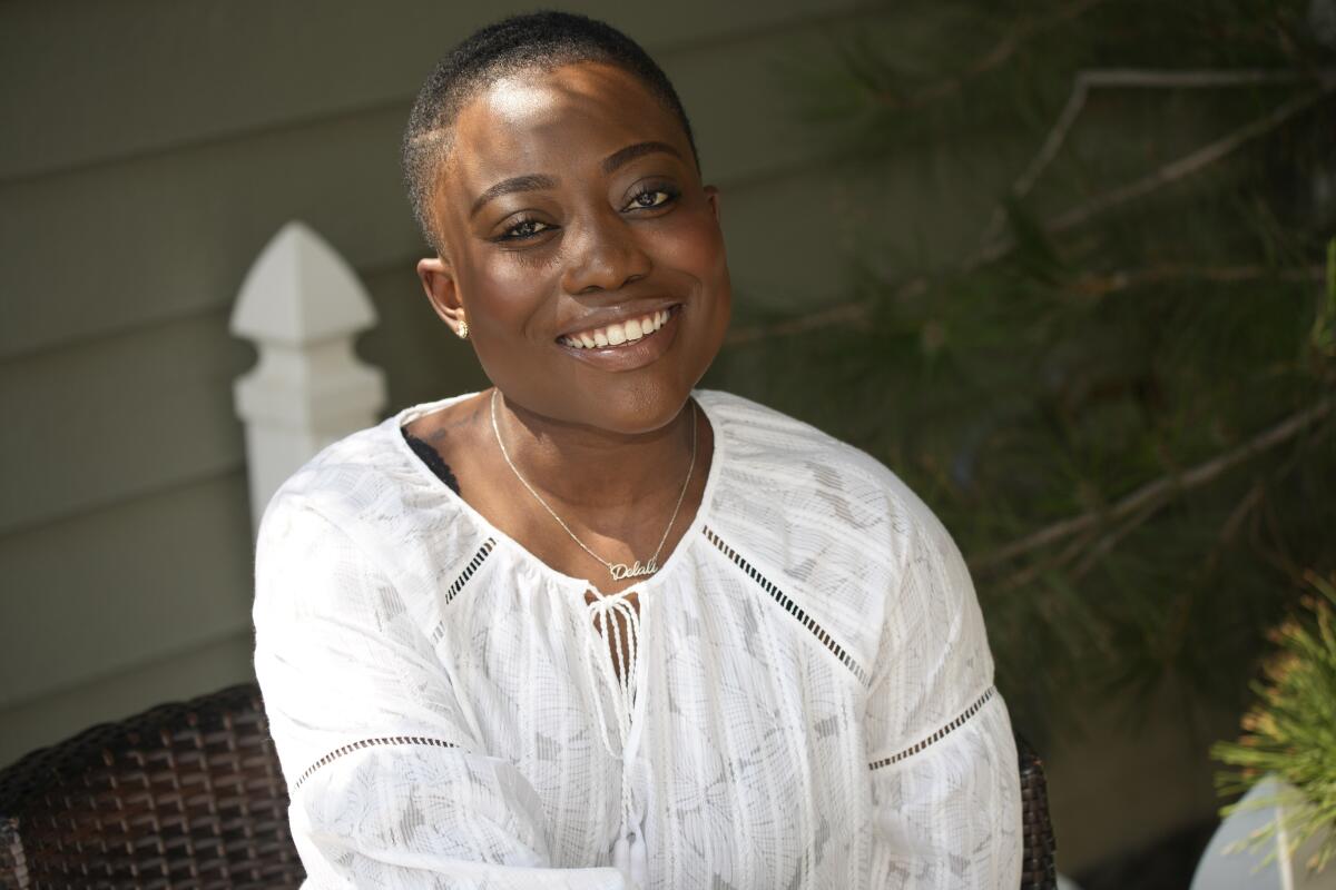 Fashion blogger Abena Antwiwaa poses at her home in Aurora, Colo.