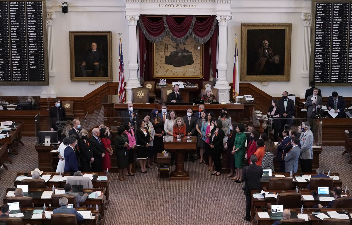 Lawmakers in a chamber.
