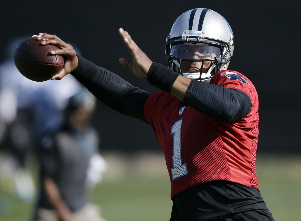 Carolina quarterback Cam Newton throws a pass during practice on Feb. 5. in preparation for Super Bowl 50.