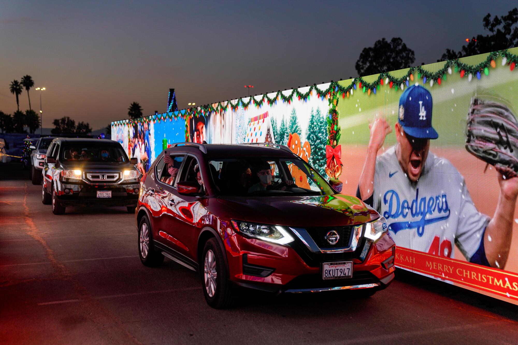  Cars make their way through the Dodger's Holiday Festival 2020 at Dodger Stadium 