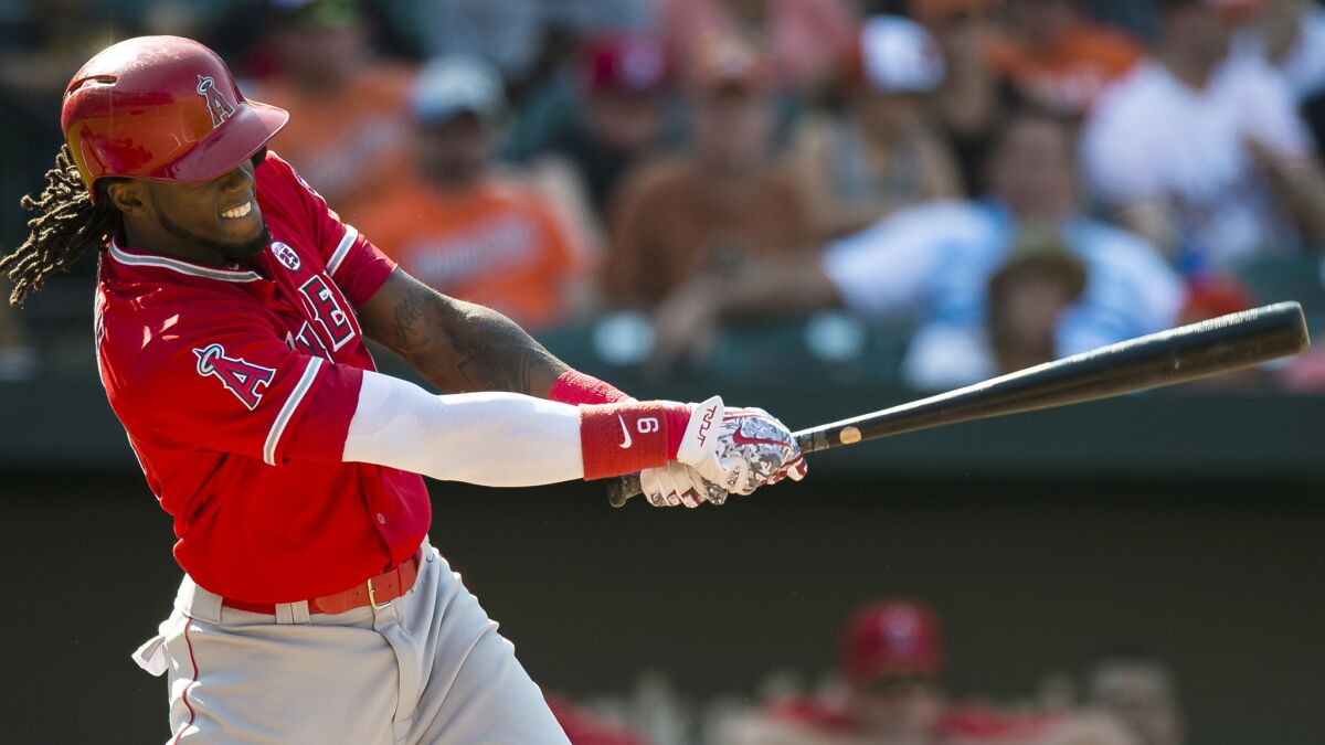 Angels pinch-hitter Cameron Maybin connects for a run-scoring single that drove in what proved to be the game-winning run against the Orioles in the eighth inning Sunday in Baltimore.