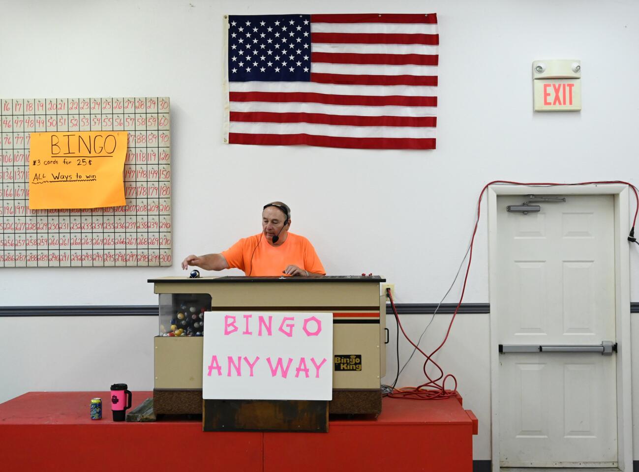 Donnie Koontz with the Harney Lions Club calls a bingo game in the hall during the carnival at the Harney Volunteer Fire Company on Tuesday, June 25.