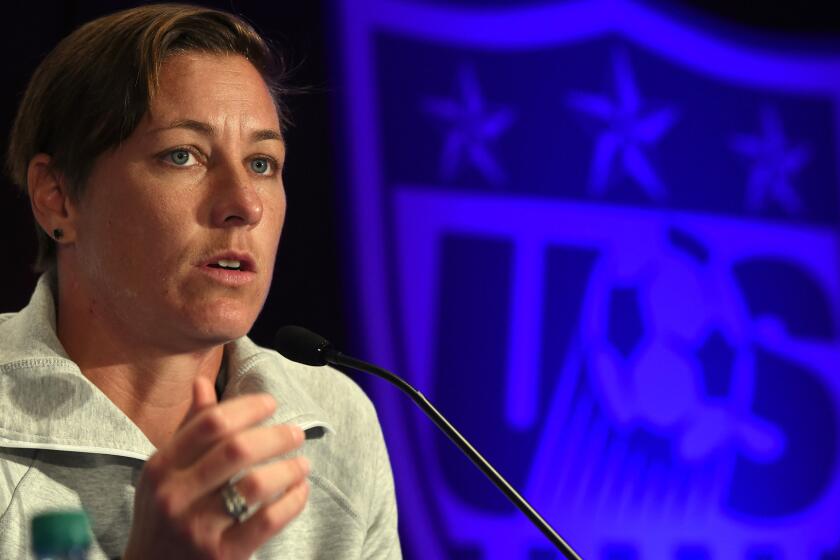 Abby Wambach addresses the media during a news conference in New York City on May 27.