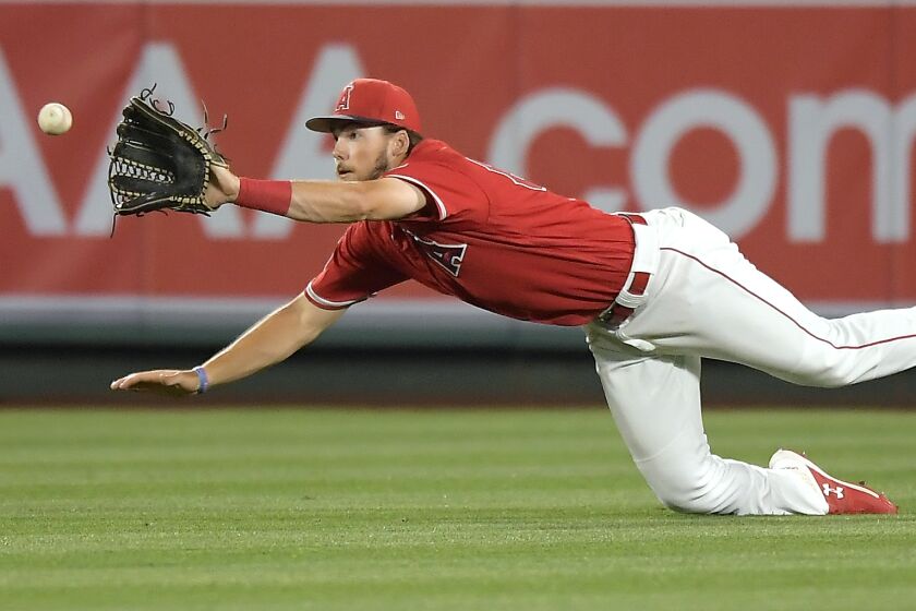 Angels outfield prospect Brandon Marsh makes a catch against the Dodgers in a preseason game March 24, 2019, in Anaheim.