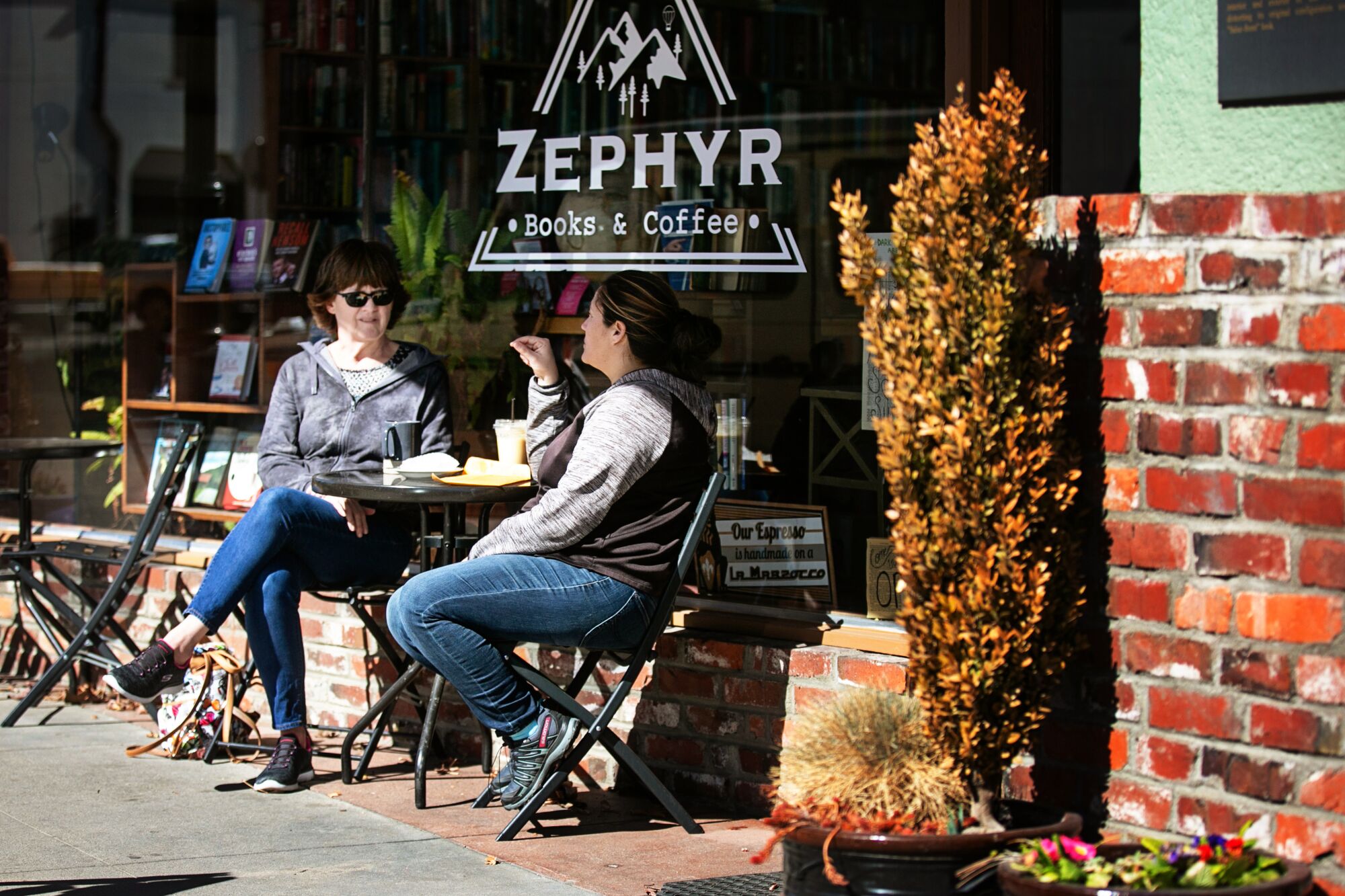 Customers enjoy a coffee at Zephyr Books and Coffee in rural Northern California