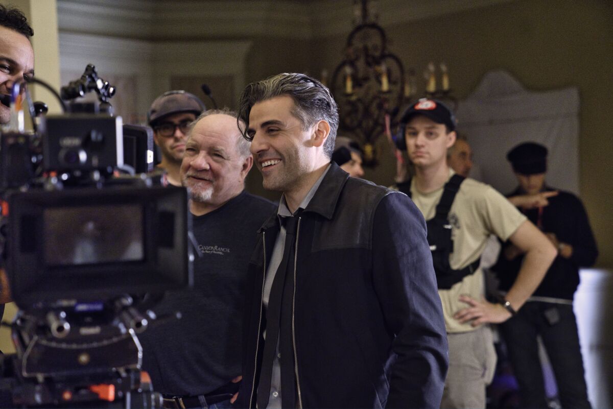 Director Paul Schrader and actor Oscar Isaac on the set of ”The Card Counter."  