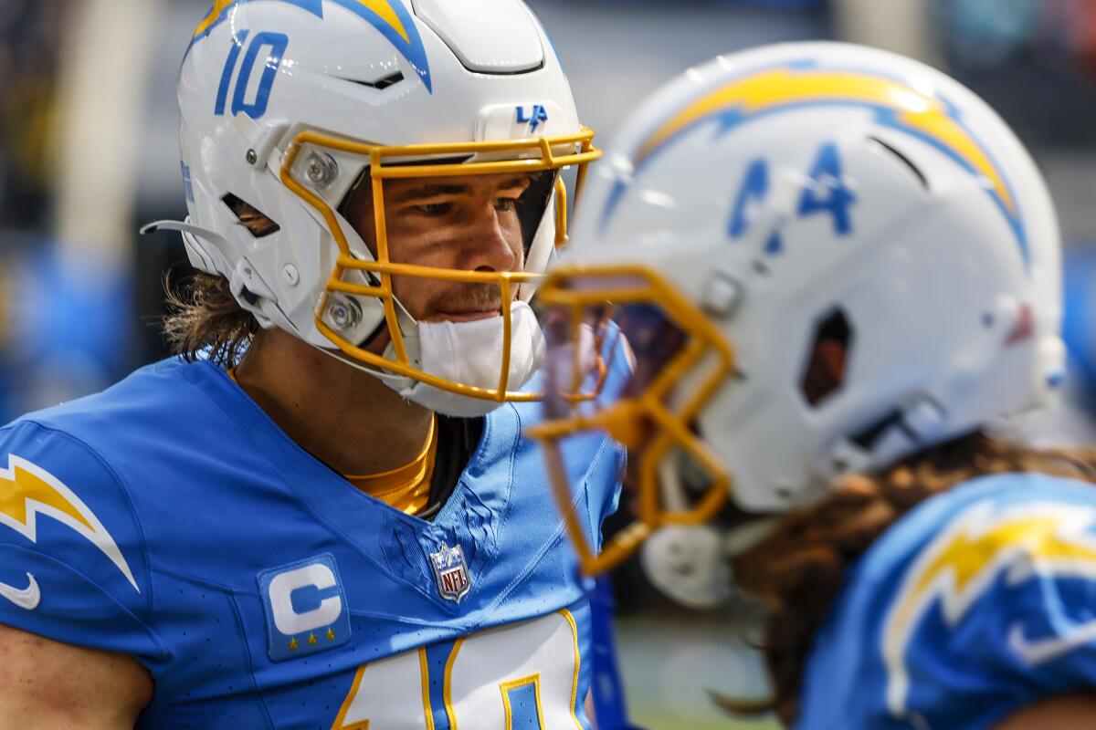 Chargers quarterback Justin Herbert stands on the sideline before a game against the Miami Dolphins in September.
