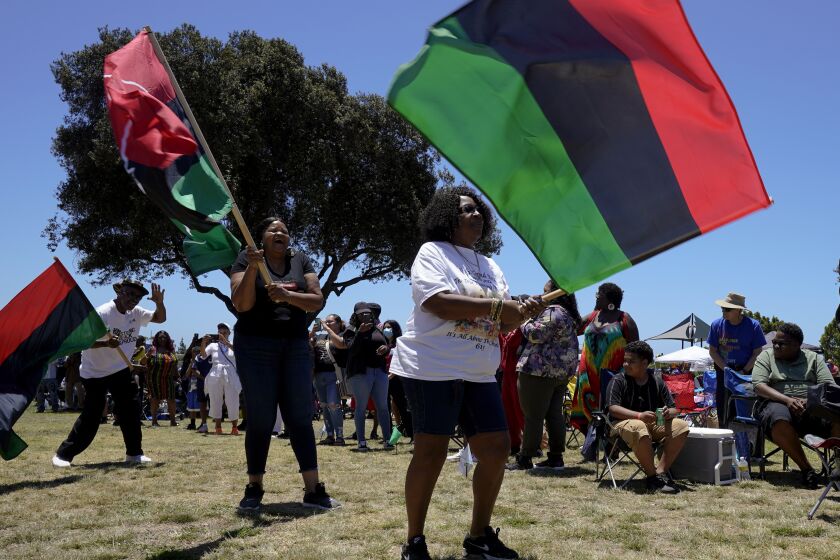 San Diego, CA - June 18: Following the drum procession, were the flag carriers for the opening ceremony at the Juneteenth celebration at Memorial Park on Saturday, June 18, 2022 in San Diego, CA. (Nelvin C. Cepeda / The San Diego Union-Tribune)