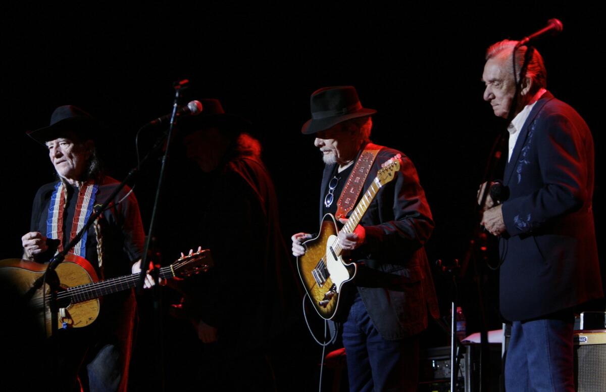 Willie Nelson, left, performs with Merle Haggard and Ray Price in Las Vegas in 2007 on their "Last of the Breed" tour.