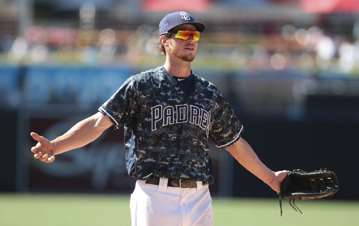 The Padres' Wil Myers gestures toward fans after he threw them a baseball in the ninth inning of the Padres' game against the Yankees at Petco Park in San Diego on Sunday, July 3, 2016.