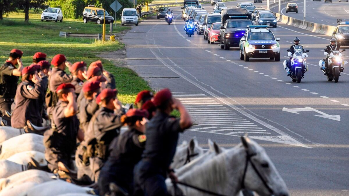A convoy carrying the bodies of five Argentine victims of the truck attack in New York heads on Nov. 6 to Rosario, the city outside Buenos Aires where the men lived.