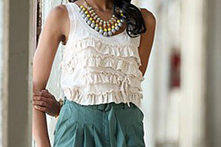 KEEPING IT SIMPLE: J. Crew tiered ruffle top, $44 at J.Crew South Coast Plaza; H&M skirt, $39.90 at H&M Beverly Center; J. Crew necklace, $150 at jcrew.com; CC Skye stud bracelet, $185; CC Skye white cabochon bangle, $110, CC Skye ring, $150, at www.ccskye.com; Jessica Elliot bracelets, $50 each at www.skinnystyle.com; Theory shoes, $335 at www.shopbop.com.