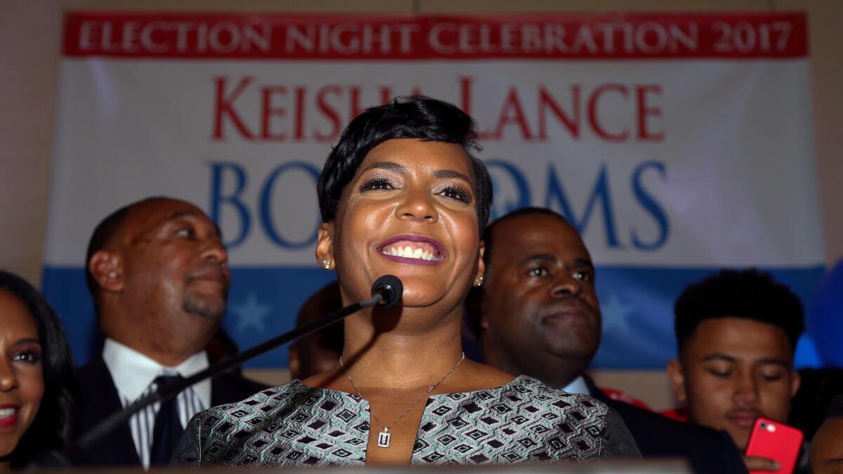 Atlanta mayoral candidate Keisha Lance Bottoms declares victory during an election night party. But with initial results showing a margin of just a few hundred votes, her rival asked for a recount.