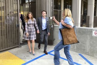 Actor Danny Masterson leaves Los Angeles superior Court with his wife Bijou Phillips after a judge declared a mistrial in his rape case in Los Angeles on Wednesday, Nov. 30, 2022. Jurors said they were hopelessly deadlocked at the trial of "That '70s Show" actor who was charged with the rape of three women, including a former girlfriend, between 2001 and 2003. (AP Photo/Brian Melley)