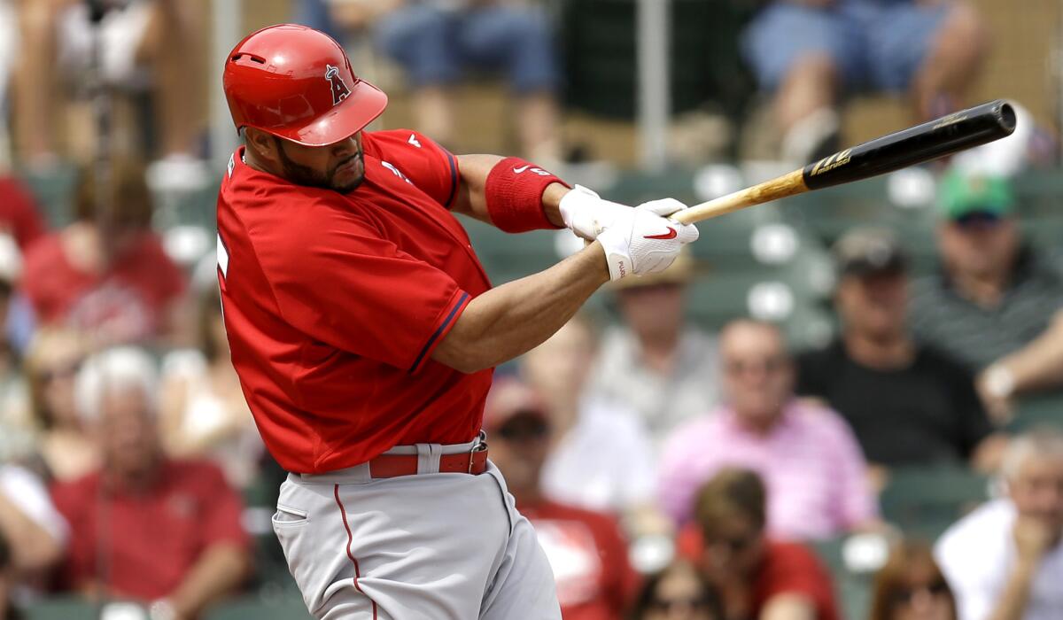 Angels first baseman Albert Pujols, shown getting a hit against the Diamondbacks on March 11, hit his first home run of the spring Thursday.