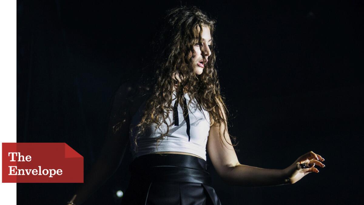 Singer and songwriter Lorde, shown here performing in September in Atlanta, underscores Katniss’ empowerment in the latest "Hunger Games" movie.