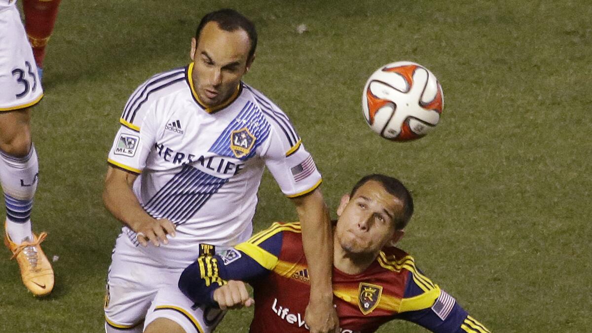 Galaxy forward Landon Donovan, left, and Real Salt Lake midfielder Luis Gil battle for the ball during a 0-0 draw in the first leg of their Western Conference semifinal matchup on Nov. 1.
