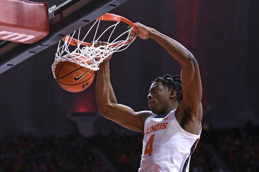 Illinois' Omar Payne dunks during the first half of the team's NCAA college basketball game against Maryland on Thursday, Jan. 6, 2022, in Champaign, Ill. (AP Photo/Michael Allio)