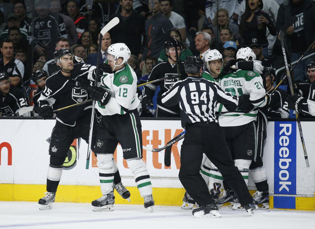 Kings forward Andy Andreoff, left, and Stars forward Radek Faksa, second left, scuffle as do some of their teammates during the third period of their Saturday game.