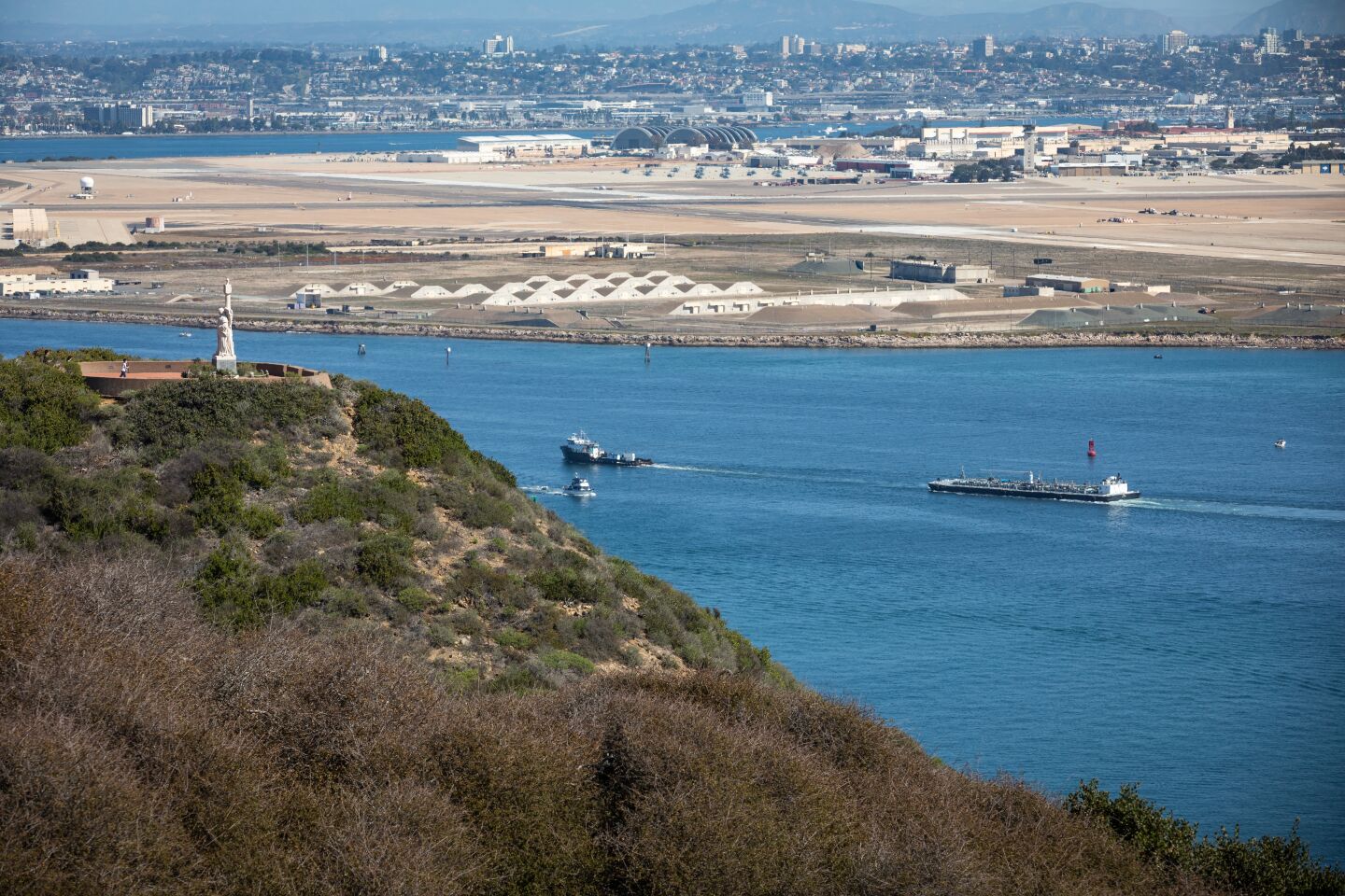 At left, the monument to explorer Juan Rodriguez Cabrillo, who in 1542 led the first European expedition that explored the west coast of what is now the United States, offers views across San Diego Bay.
