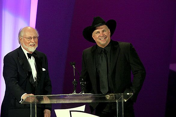 The Hollywood Bowl Hall of Fame's first inductees, composer John Williams, left, and country star Garth Brooks, talk about the history of the honor. They were inducted in 2000. The annual Hall of Fame event has raised more than $6 million over the years for the Los Angeles Philharmonic's Music Matters music education program.