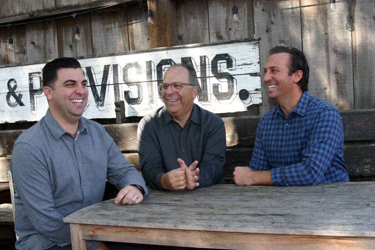 Brothers Brandon Ross, left, and Ryan Ross, right, pictured here with their father, Old Town restaurateur Chuck Ross, have gone solo to open Carte Blanche, a French-inspired Mexican bistro in Oceanside.