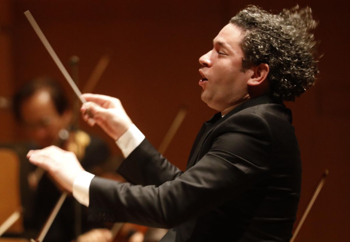 Gustavo Dudamel conducting the Los Angeles Philharmonic through Ives’ First Symphony on Feb. 20 at Walt Disney Concert Hall.