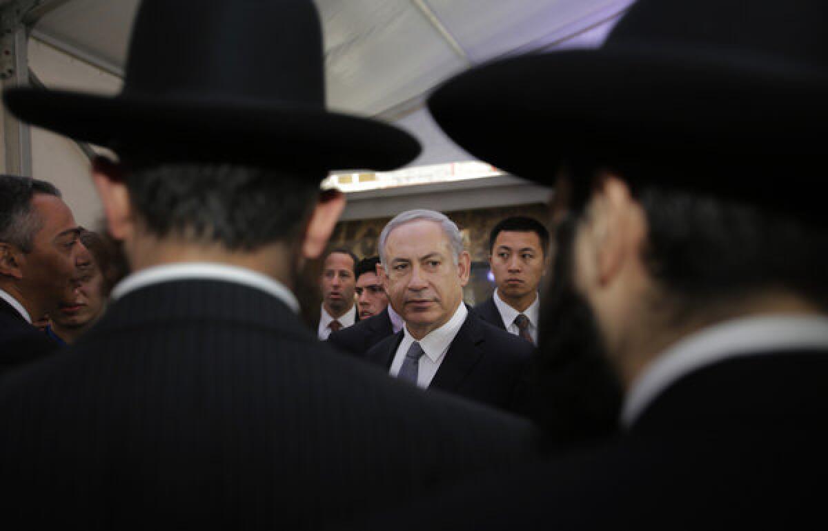 Israeli Prime Minister Benjamin Netanyahu, center, meets rabbis as he visits the Shanghai Jewish Refugees Museum at former site of Ohel Moshe Synagogue in China.