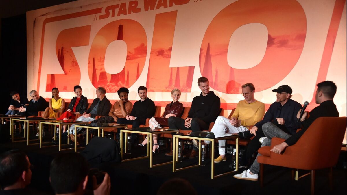 Cast and writers from "Solo" attend a conference Saturday in Pasadena From left: Jon Kasdan, Lawrence Kasdan, Thandie Newton, Phoebe Waller-Bridge, Woody Harrelson, Donald Glover, Alden Ehrenreich, Emilia Clarke, Joonas Suotamo, Paul Bettany and Ron Howard.