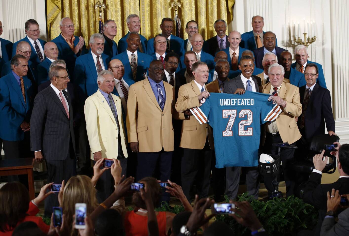 U.S. President Obama honors the 1972 season Miami Dolphins, the NFL Superbowl-winning football team in the East Room of the White House in Washington
