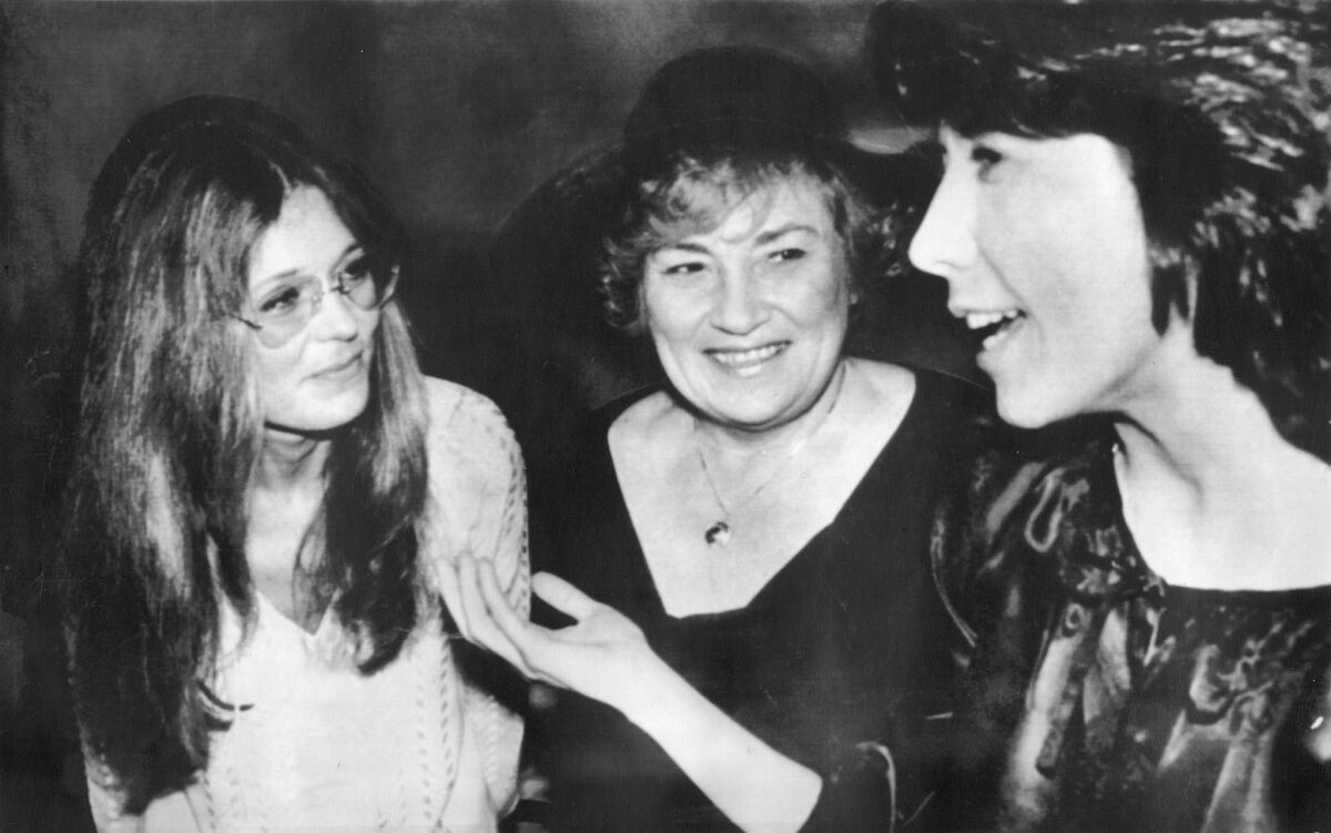 Bella Abzug, center, with Gloria Steinem and Lily Tomlin in New York City in 1977.