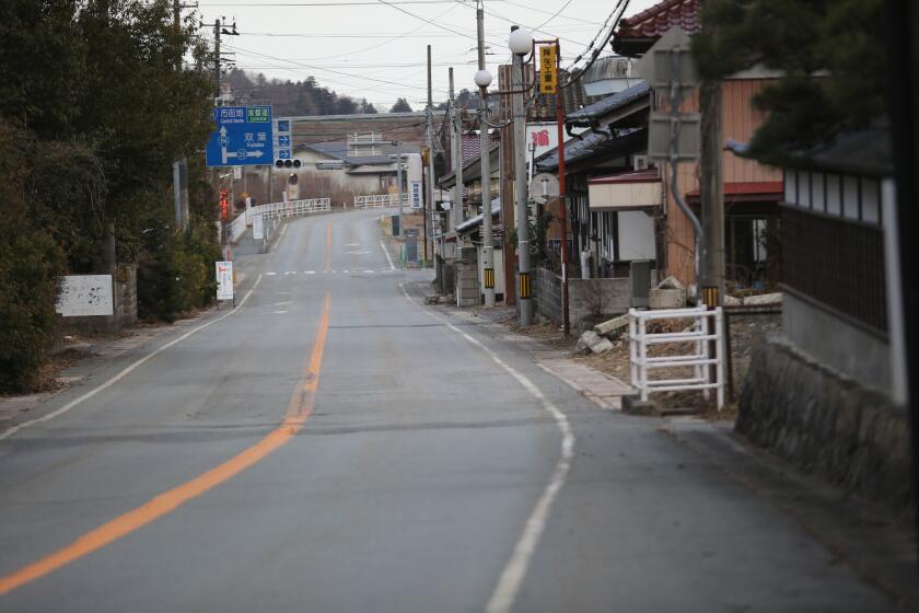 A deserted street inside the exclusion zone close near the Fukushima Daiichi Nuclear Power Plant.
