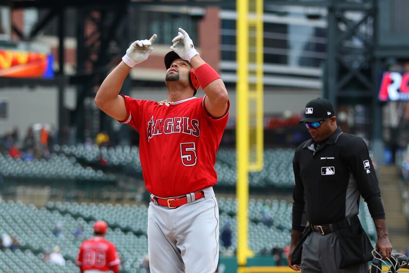 DETROIT, MICHIGAN - MAY 09: Albert Pujols #5 of the Los Angeles Angels reacts to his third inning solo home run to reach 2000 career RBI's while playing the Detroit Tigers at Comerica Park on May 09, 2019 in Detroit, Michigan. (Photo by Gregory Shamus/Getty Images)