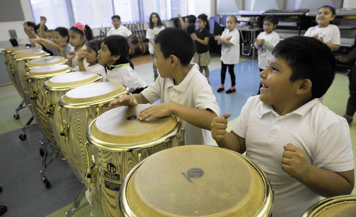 Students play drums in Bladimir Castro's music class at Carlos Santana Arts Academy in North Hills. It is the highest-rated elementary school for arts classes, and more than 90% of its students are low-income.