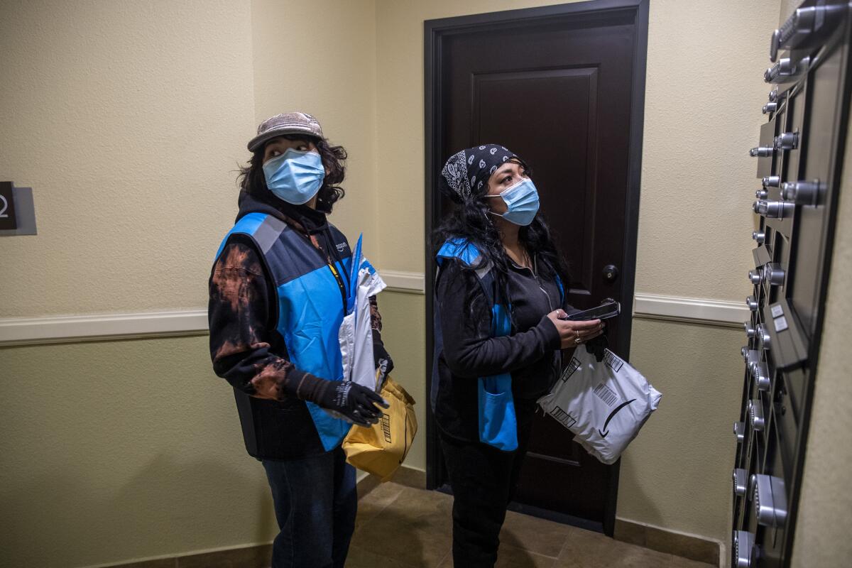 High school senior Isis Mejia-Duarte and her mom, Marisol Duarte, deliver packages for Amazon on Jan. 27.