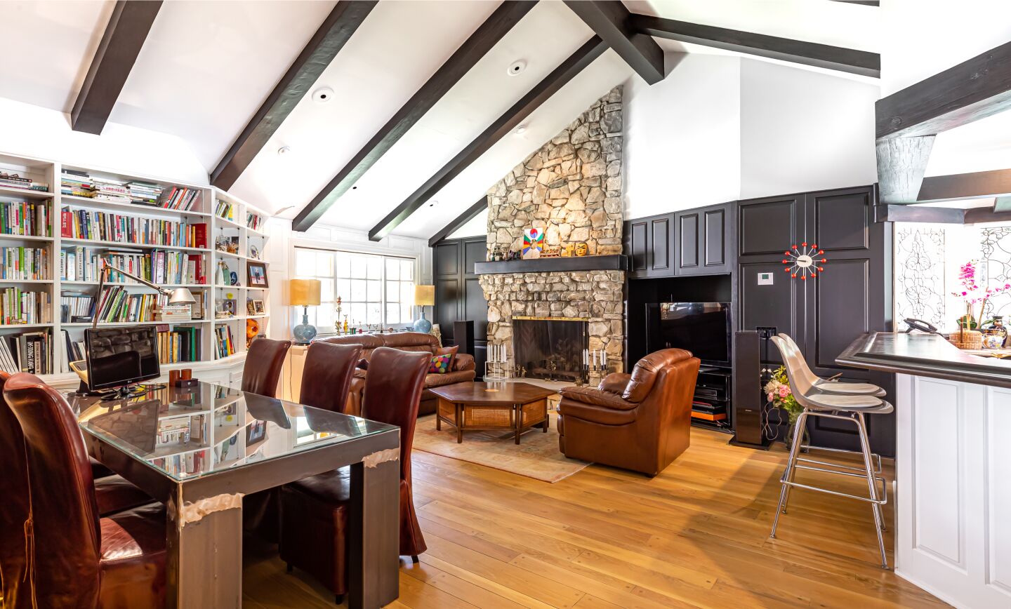 Spanning two parcels on two acres, the Fryman Estates property holds a 7,000-square-foot home, a swimming pool, spa and tennis court.