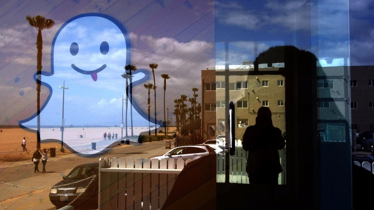 The Snapchat logo seems to float over Ocean Front Walk in Venice in 2013.