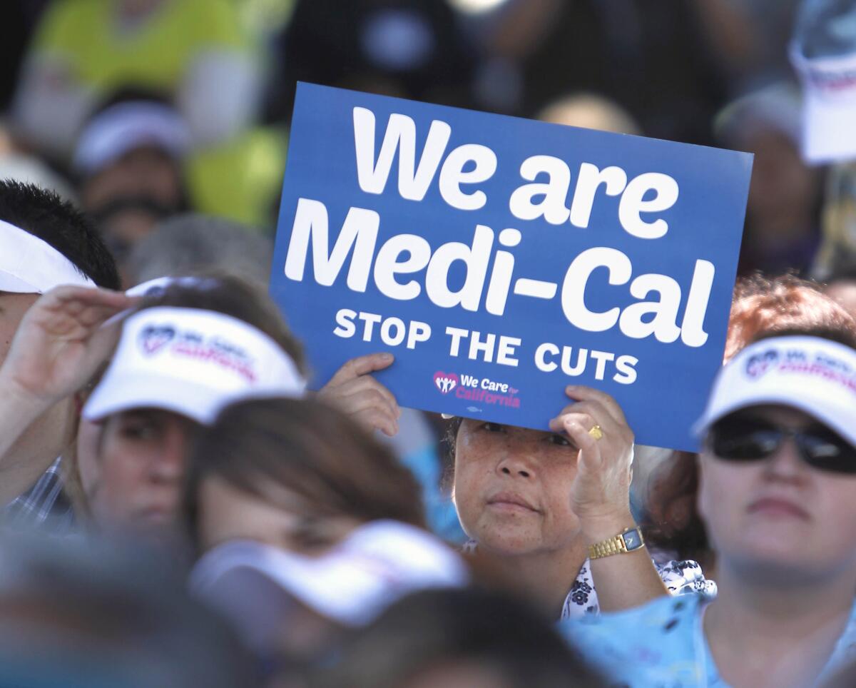 Demonstrators representing doctors, hospitals and unionized healthcare workers rallied against a 10% cut in the amount the state pays for Medi-Cal reimbursements, at the Capitol in Sacramento.