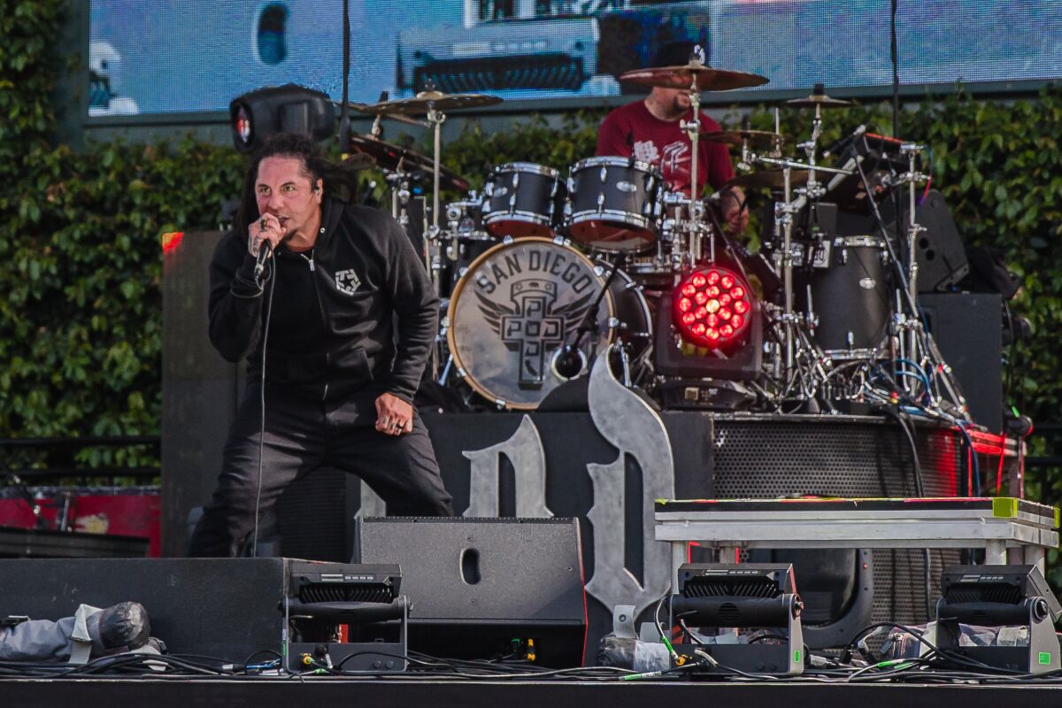 Sonny Sandoval and Wuv Bernardo of P.O.D (Payable on Death) perform in front of the cameras at Petco Park on April 14, 2021.