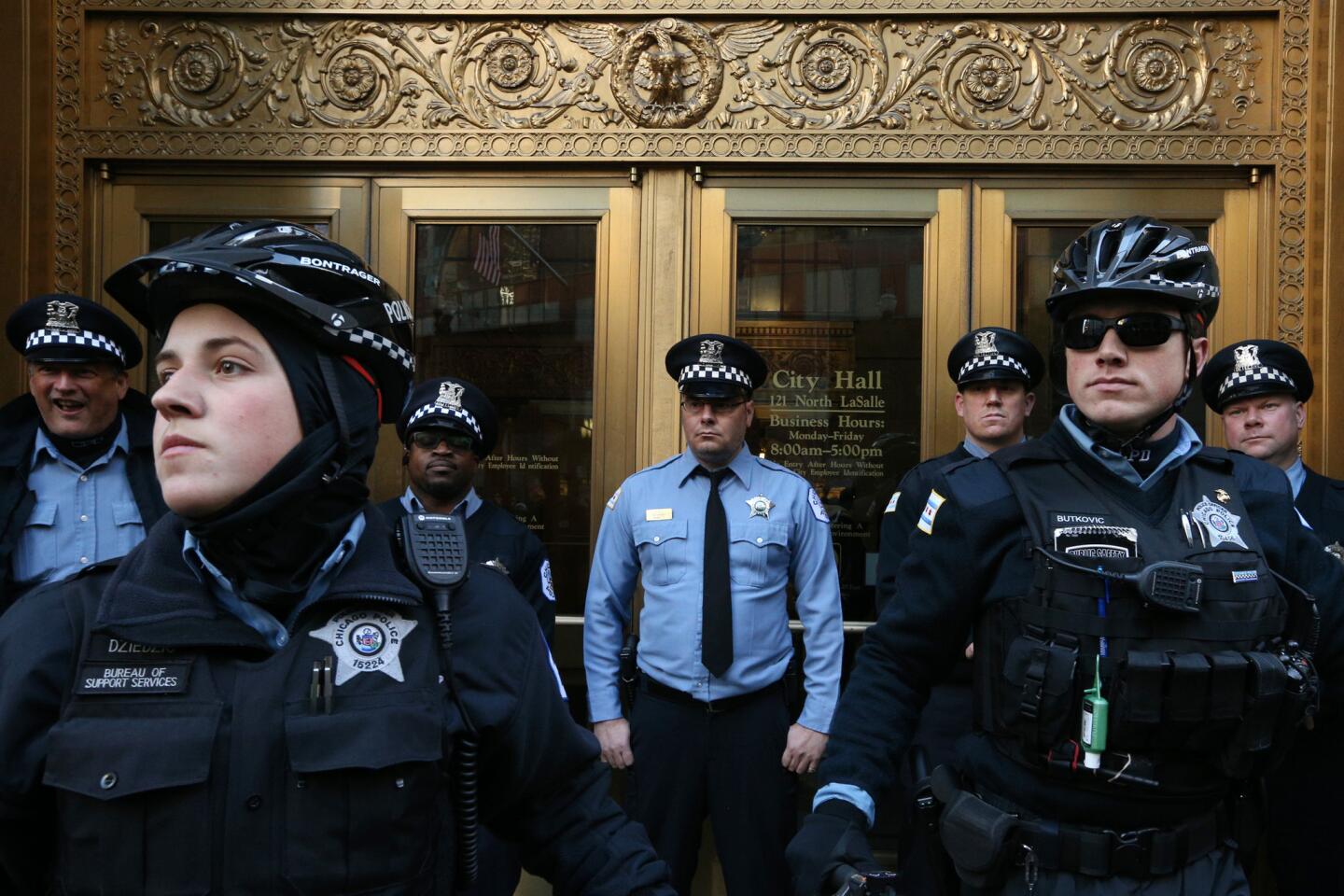 Chicago police officers block entry to City Hall during a march on Dec. 9, 2015, calling for Mayor Rahm Emanuel to resign.
