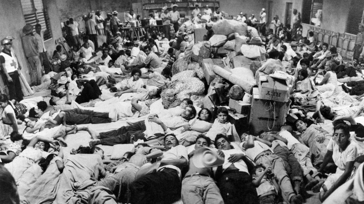 Salvadoran refugees working in Honduras are housed at Red Cross headquarters in San Miguel on July 7, 1969, following the start of the Football War.
