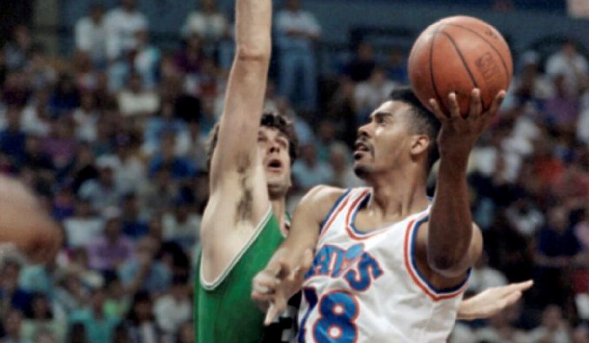Cavaliers forward John Williams (18) goes up for a shot against Celtics forward Kevin McHale during a 1992 Eastern Conference semifinal playoff game.